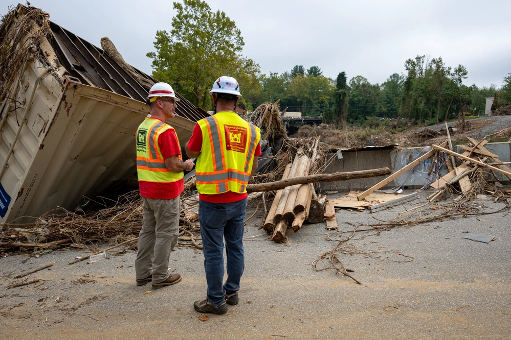 George Delancey and Greg Rudy with the U.S. Army Corps of Engineers, Louisville District debris team, assess the extent of debris created by Hurricane Helene in Asheville, North Carolina, Oct. 5, 2024.
