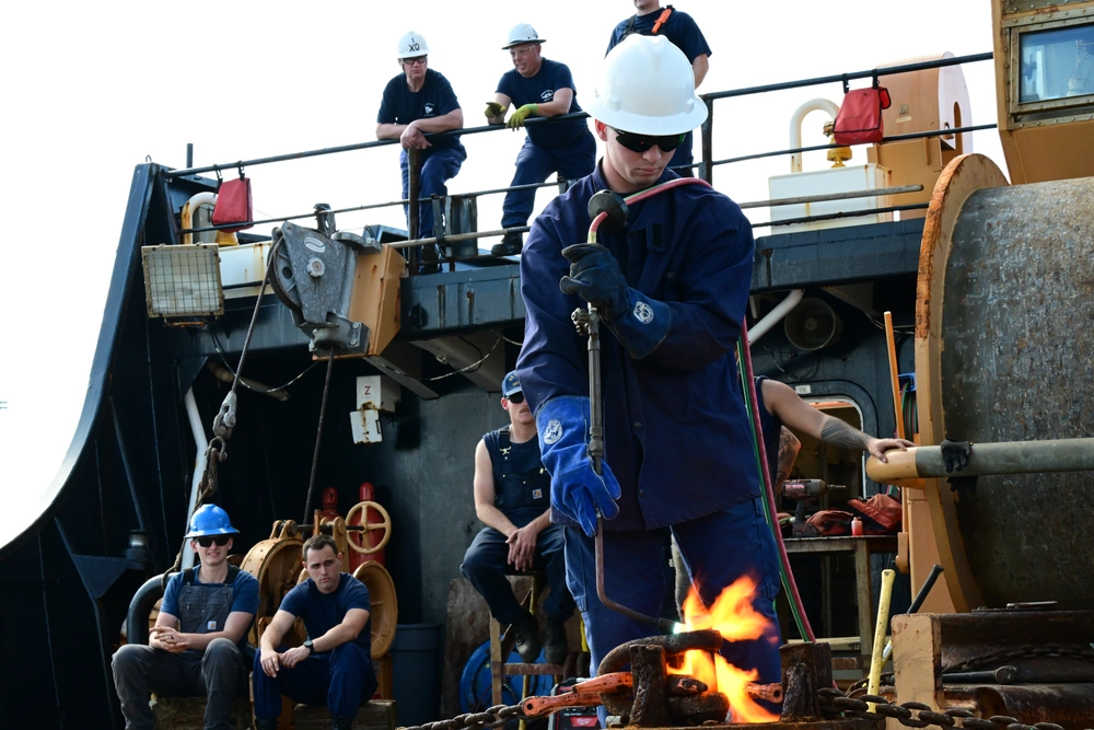 A pin is heated up prior to a heat and beat Oct. 23, 2024, during the annual Buoy Tender Round-up held in Portsmouth, Virginia.