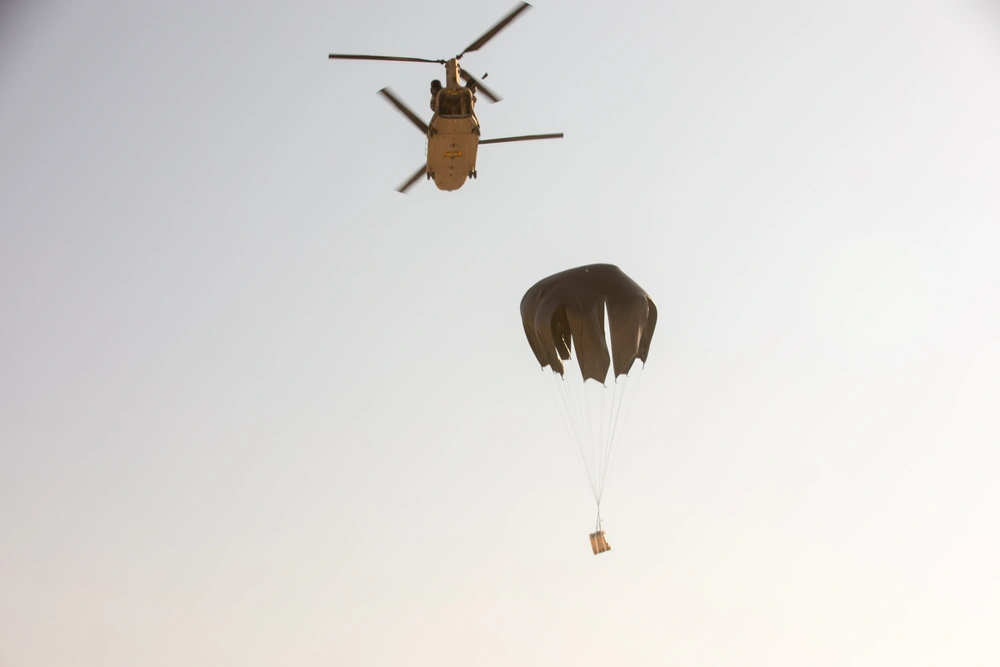 A CH-47 Drops an MRE Pallet During LCLA Operations