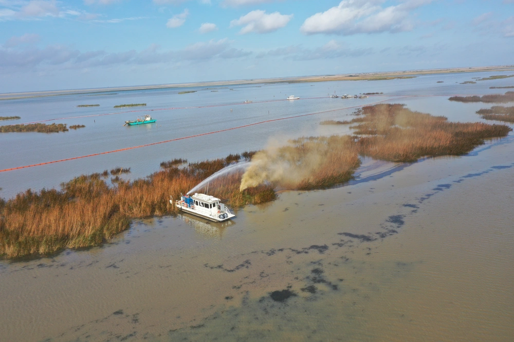 An overflight displays the affected area of marsh environment near Garden Island Bay, Louisiana on April 30, 2025. A safety zone has been enacted in the area and boom has been placed to contain the released product. (U.S. Coast Guard courtesy photo) 