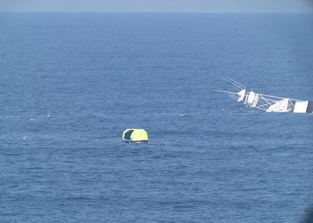 Two men are rescued by the USCGC Calhoun (WMSL 759) crew, June 12, 2025 from a life raft after their 57-foot sport fisher vessel, Turn Me Loose, sank 34 miles southeast of Virginia Beach, Virginia. 