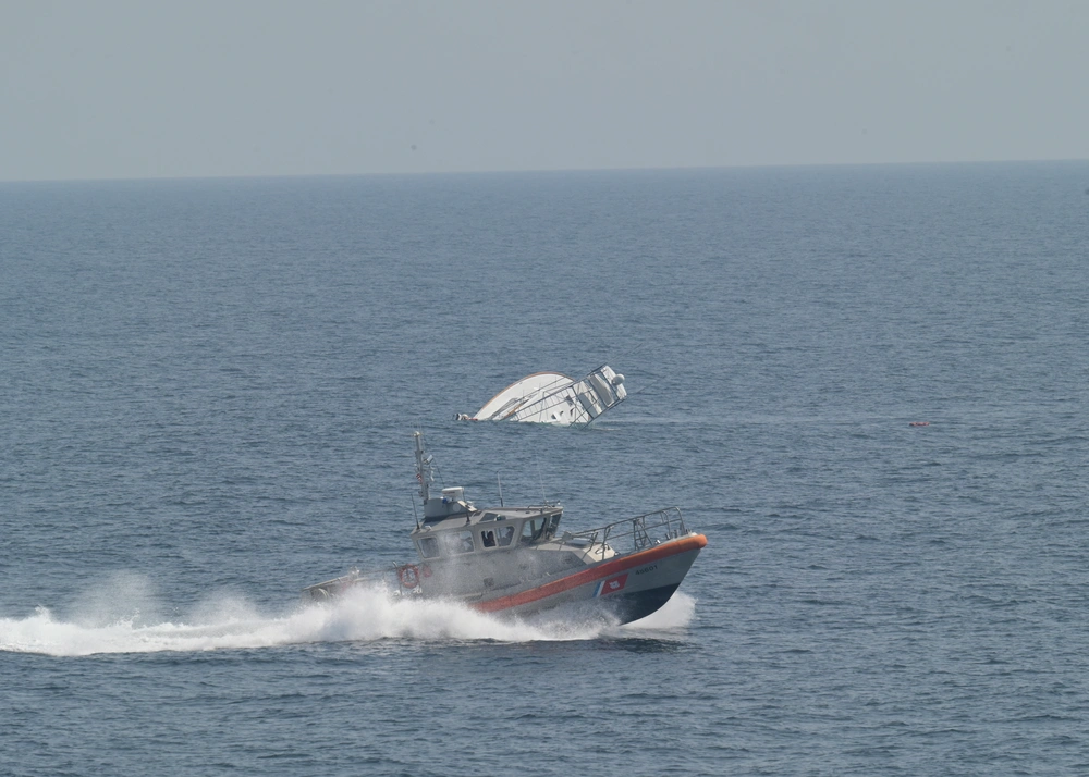 Two men are rescued by the USCGC Calhoun (WMSL 759) crew, June 12, 2025 from a life raft after their 57-foot sport fisher vessel, Turn Me Loose, sank 34 miles southeast of Virginia Beach, Virginia. Two men are rescued by the USCGC Calhoun (WMSL 759) crew, June 12, 2025 from a life raft after their 57-foot sport fisher vessel, Turn Me Loose, sank 34 miles southeast of Virginia Beach, Virginia.