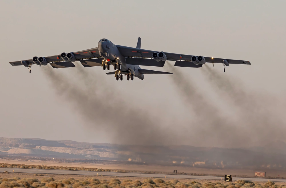 A modified B-52H Stratofortress departs Edwards Air Force Base for an evening training mission on June 25, 2025. Credit: Chase Kohler