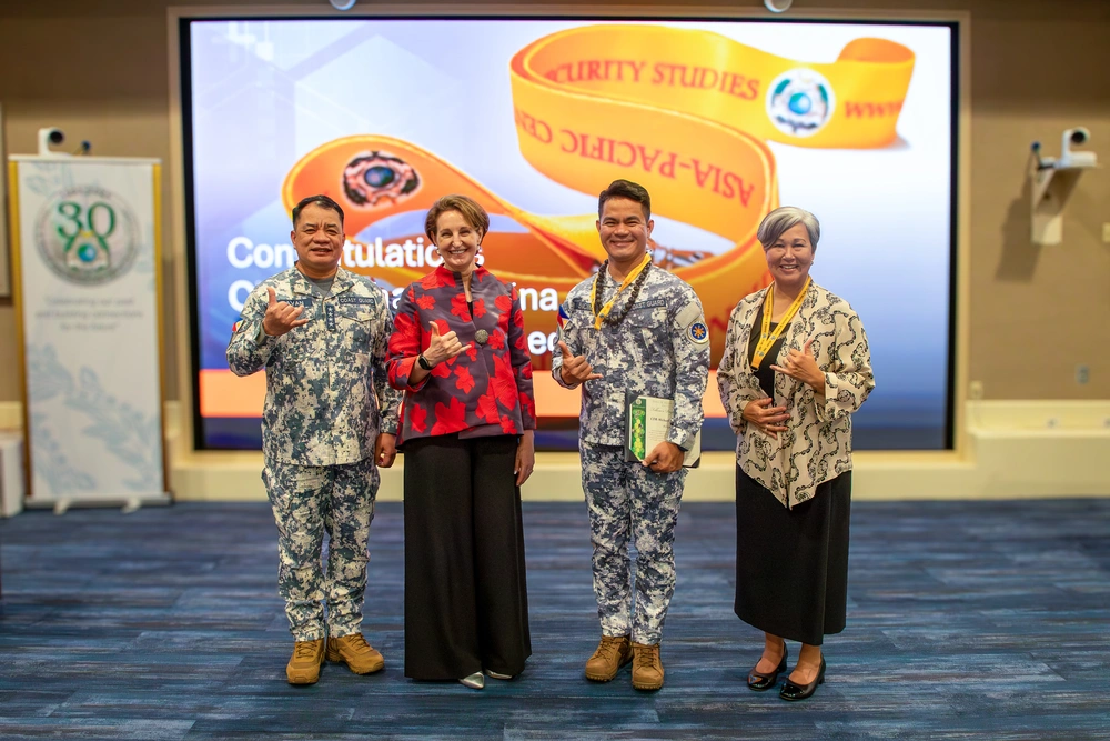Cmdr. Michael John Encina Padua awarded the DKI APCSS Fellows Project Laulima lanyard