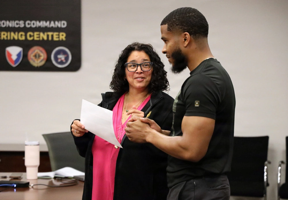 Colleagues and representatives meet to discuss opportunities at the summer reskilling and upskilling open house