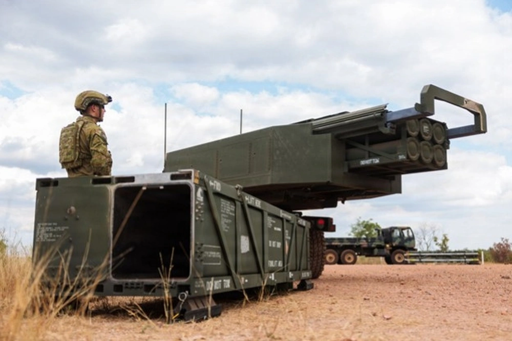Australian Army soldier Gunner Zaryn Monson from 54 Siege Battery, 14th Regiment, Royal Australian Artillery, loads a Guided Multiple Launch Rocket System onto a HIMARS after firing a PrSM at Mount Bundey Training Area, Northern Territory during Exercise Talisman Sabre 2025.
