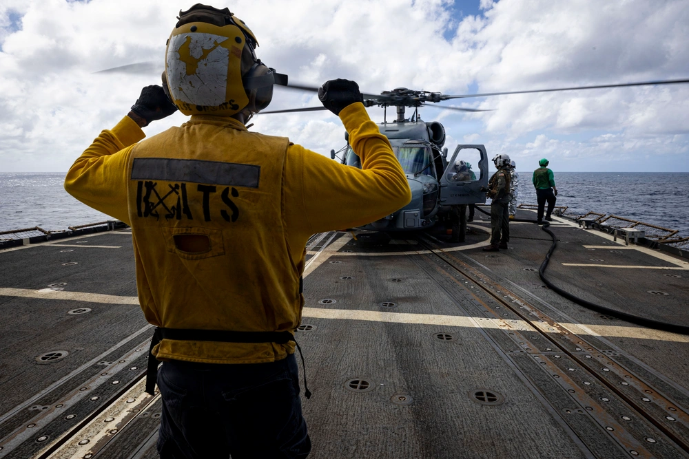 DVIDS - Images - U.S. Sailor signals to flight deck crew near an MH-60R ...