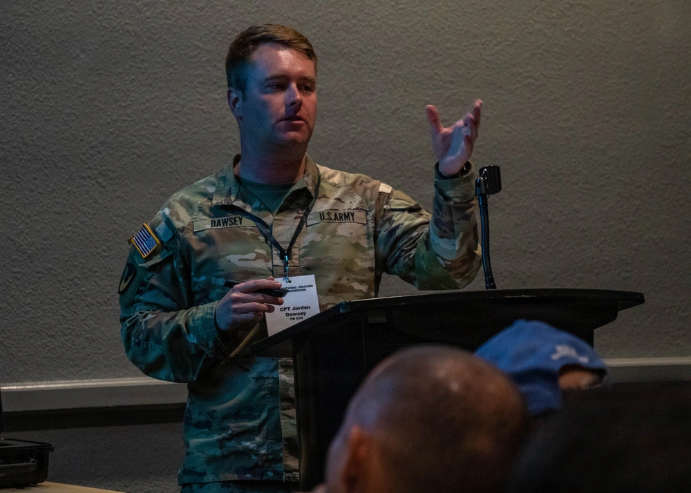 Assistant project manager of Terrain Shaping Obstacles at PM CCS, Capt. Jordan Dawsey, delivers an in-depth explanation of the M139 Volcano system, highlighting its technical specifications and applications.
