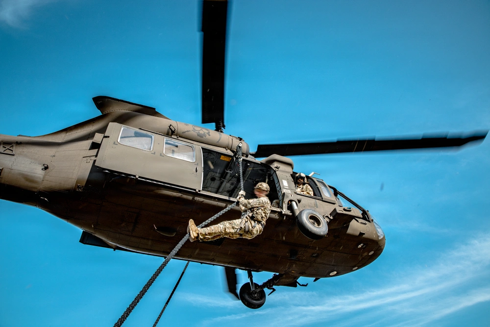 DVIDS - Images - 7th SFG (A) soldier fast ropes from UH-60 [Image 8 of 11]