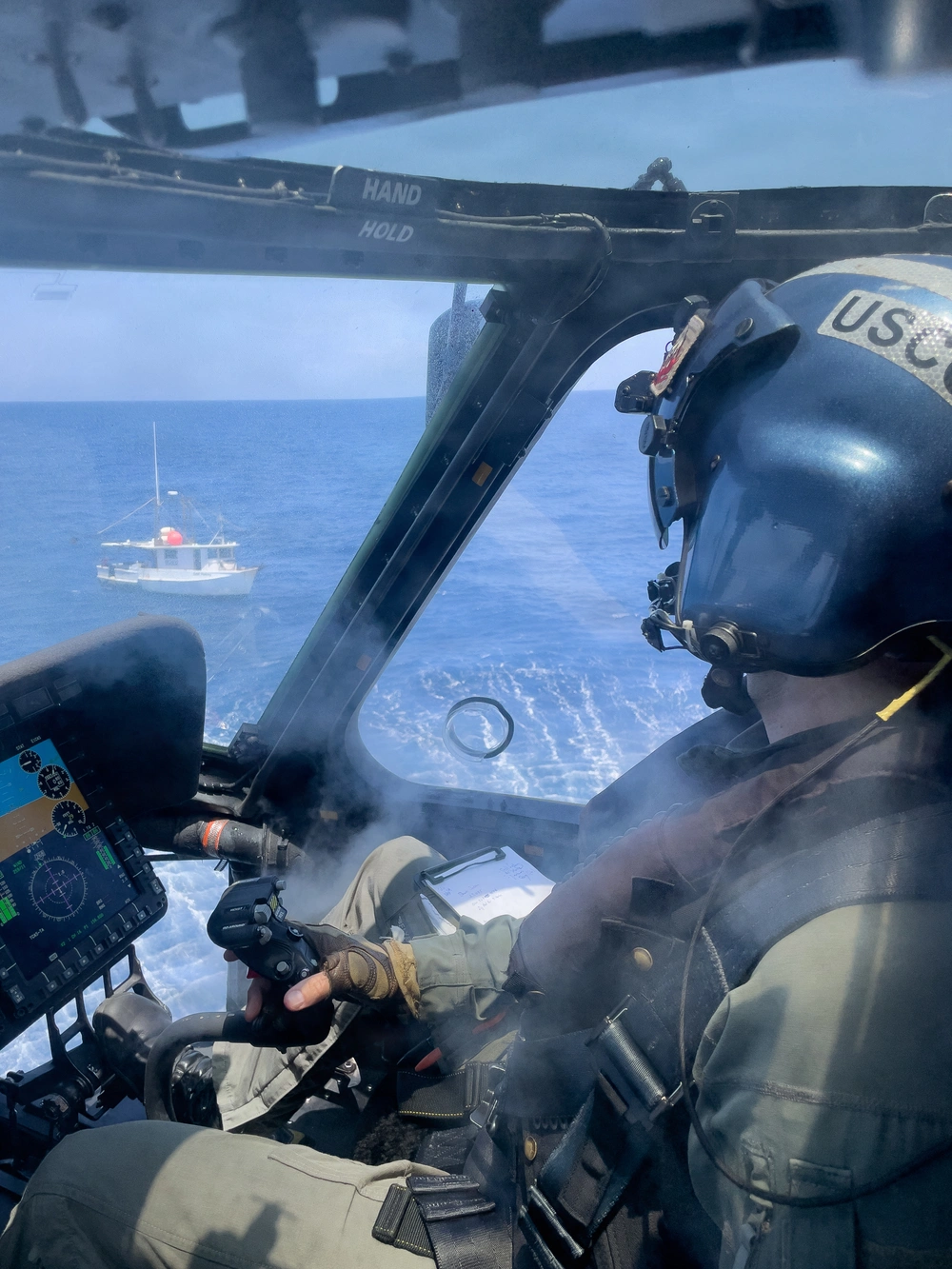 A Coast Guard Air Station Clearwater helicopter crew conducts a medevac for a 56-year-old aboard a fishing vessel 92 miles offshore Brunswick, Georgia, June 12, 2026. The man was hoisted by the helicopter crew and transported to St. Simons Island Airport in Georgia, where he was transferred to EMS for further care. (U.S. Coast Guard photo, courtesy Air Station Clearwater)