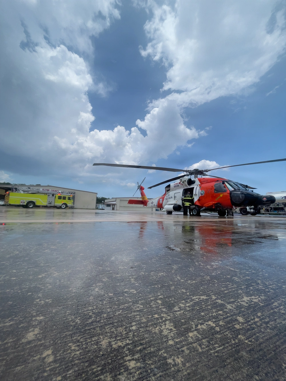 A Coast Guard Air Station Clearwater helicopter crew transfers a 56-year-old man to EMS at St. Simons Island Airport in Georgia, June 12, 2026. The man was medevaced from a fishing vessel 92 miles offshore Brunswick, Georgia. (U.S. Coast Guard photo, courtesy Air Station Clearwater)